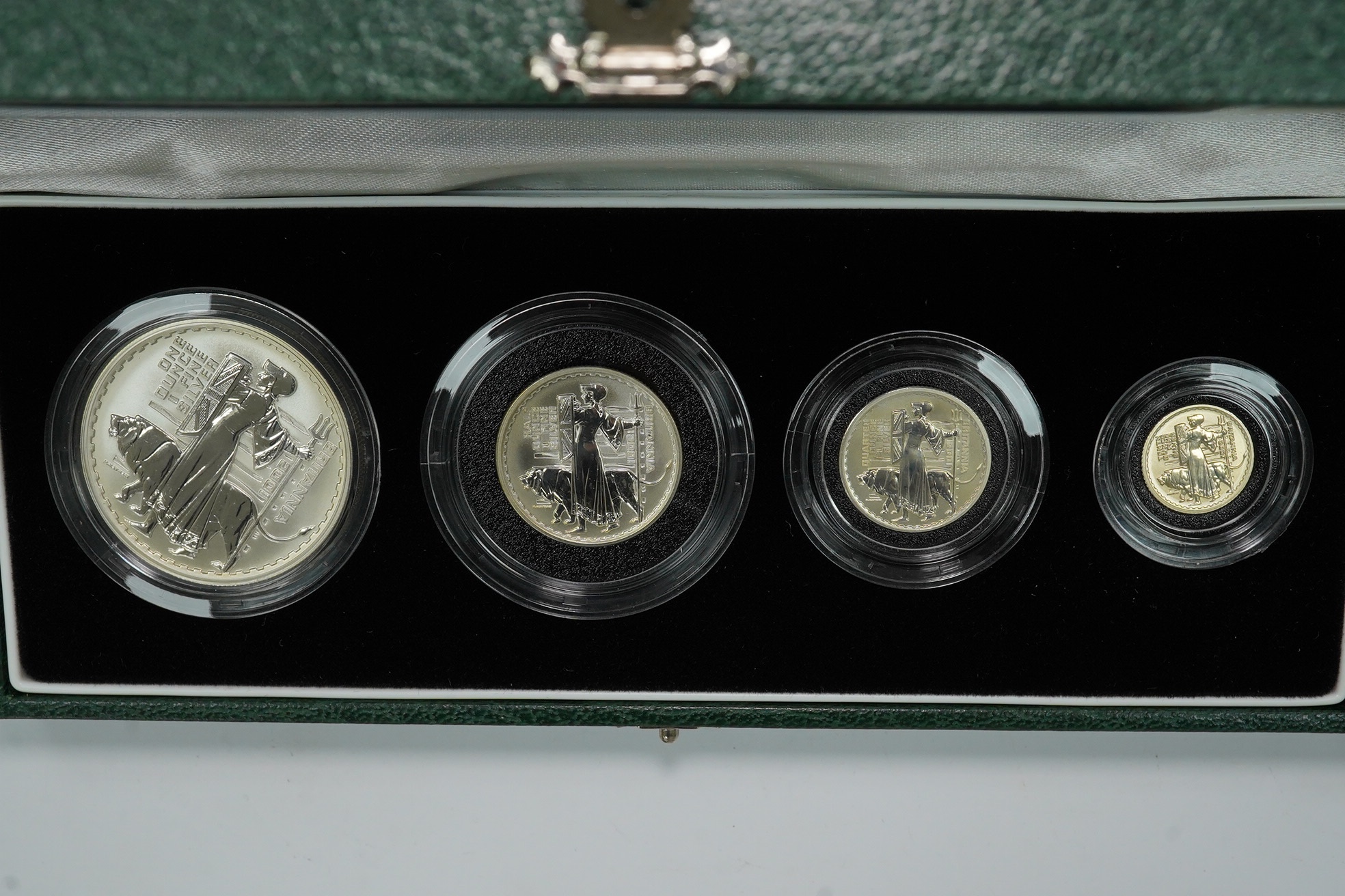 Royal Mint UK QEII coins, four Britannia collection silver proof four-coin sets, 1997, 2001, 2005 and 2007, in case of issue with certificate (4)